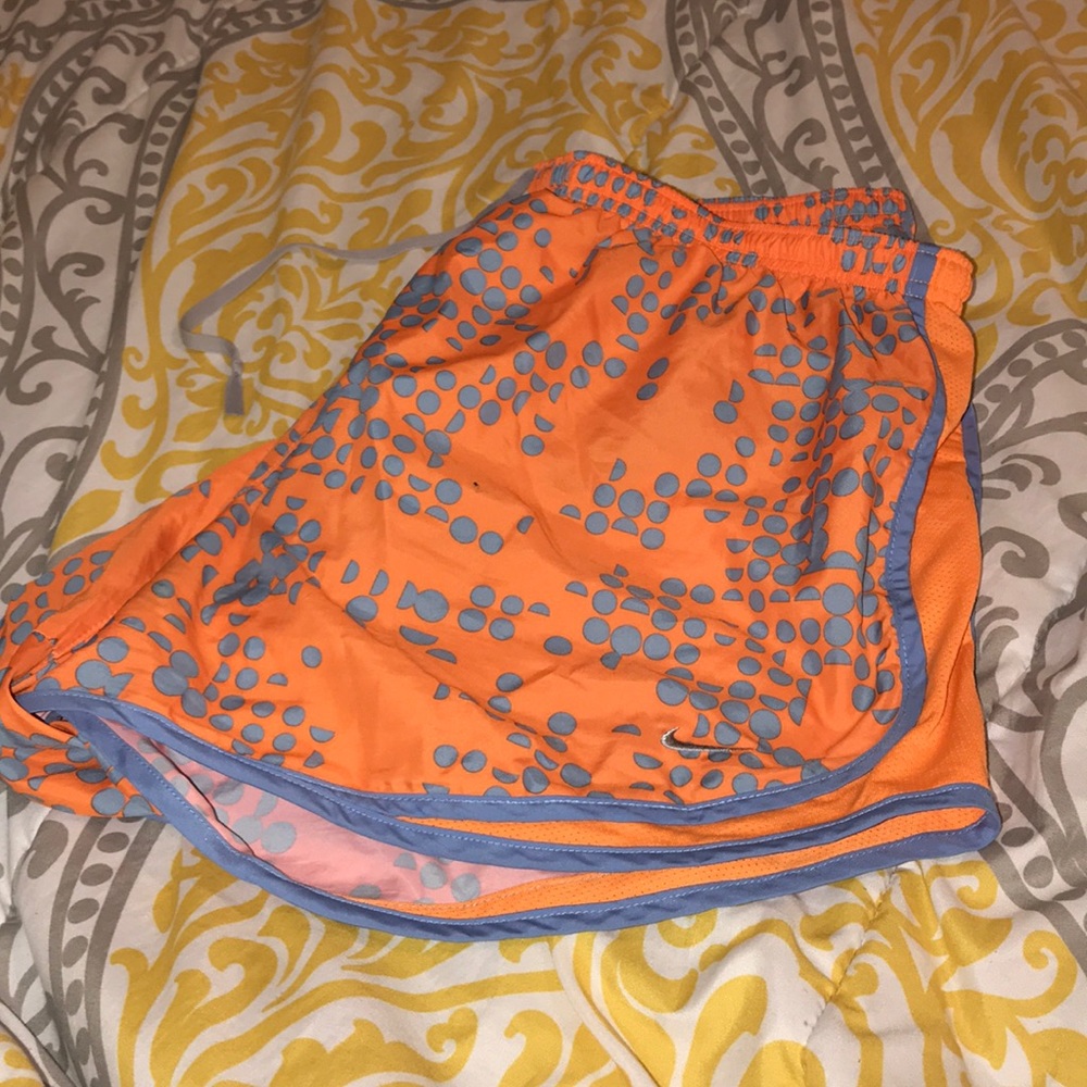 Orange Nike athletic shorts